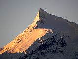 08 Phola Gangchen Close Up At Sunrise From Shishapangma North Base Camp Phola Gangchen (7661m) glows at sunrise from Shishapangma North Base Camp (5029m). Phola Gangchen (Molamenqing) was first climbed by Bruce Farmer and Dick Price of New Zealand on May 14, 1981. They were followed by Warwick Anderson and Ron McLeod on May 16 and Geoff Gables, Bruce Clark, Paul Chapman and Tony Charlton on May 20.